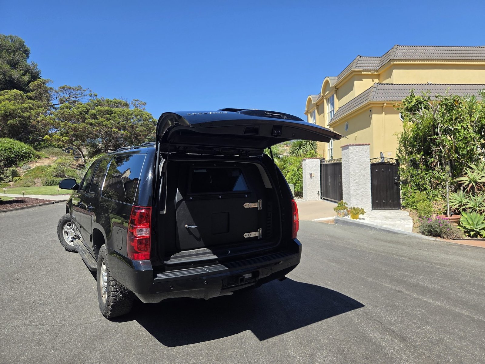 Rear liftgate raised, showing the armored bulkhead