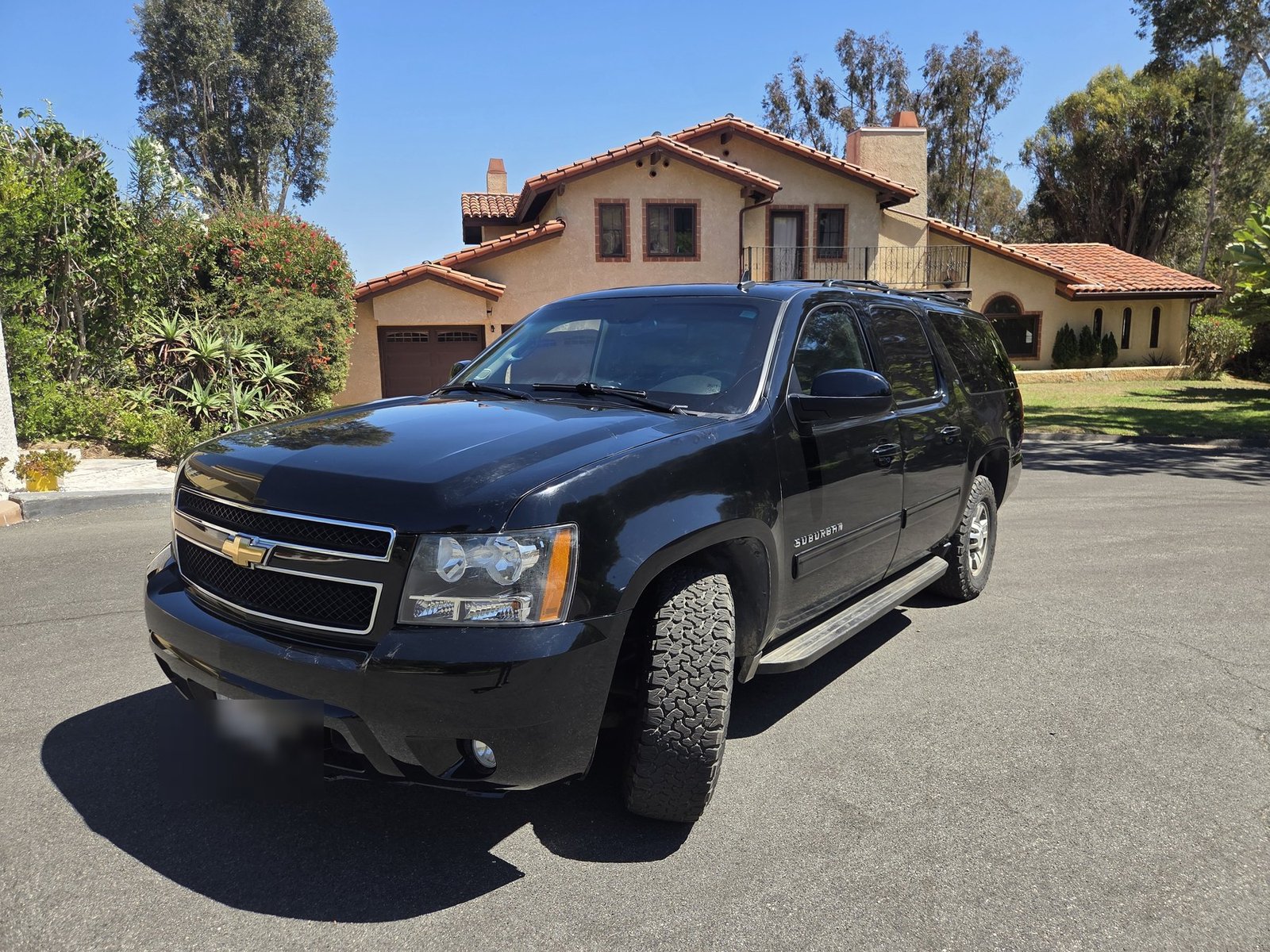 Front three-quarter parked at a house